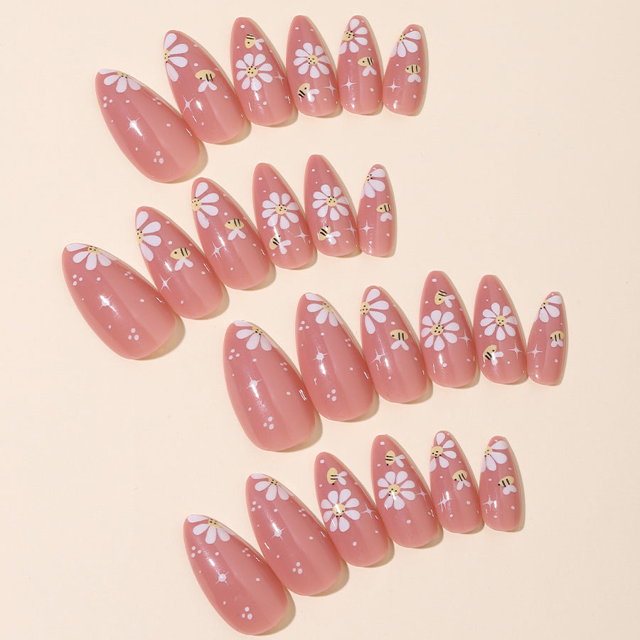 Artificial nails set with elegant flowers and glitter accents Bowlift