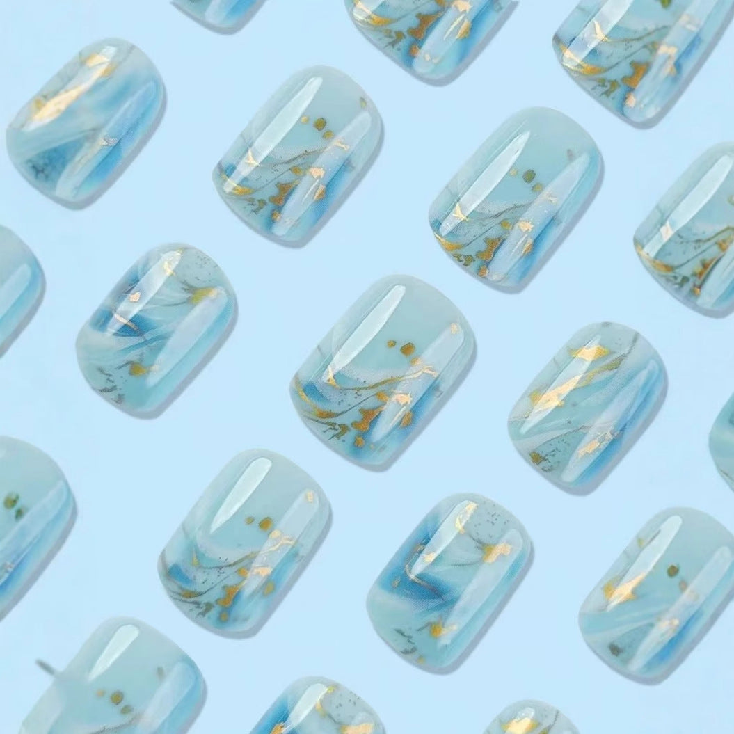 Acrylic nail set with luxurious marble design and gold accents Bowlift