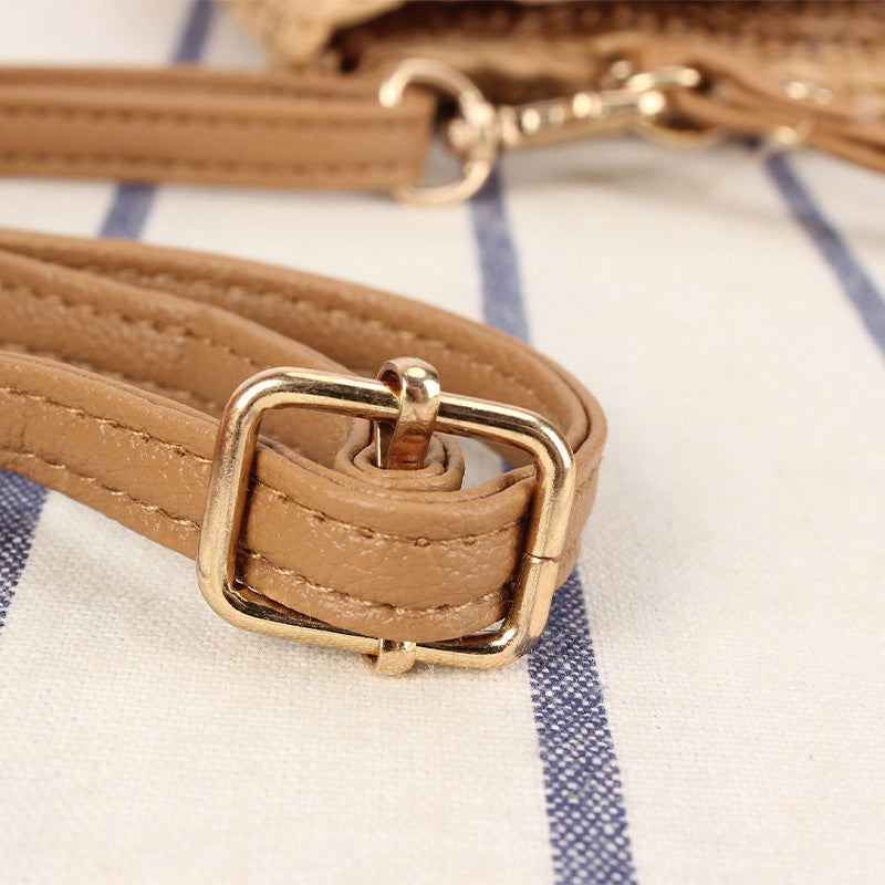 Shoulder bag made of high-quality woven natural material with elegant wave pattern Bowlift