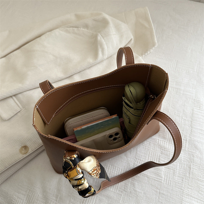 Elegant Structured Tote Handbag with Decorative Scarf