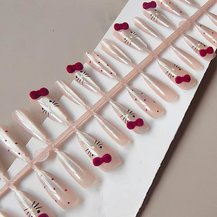 Artificial nails with playful Hello Kitty design Bowlift