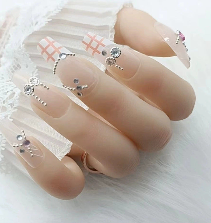 Elegant nail design with pearl embellishment Bowlift