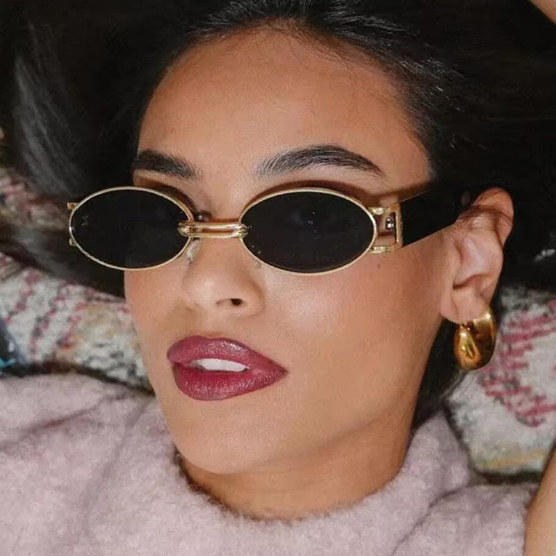Women oval-shaped sunglasses with golden accents and stylish frame Bowlift