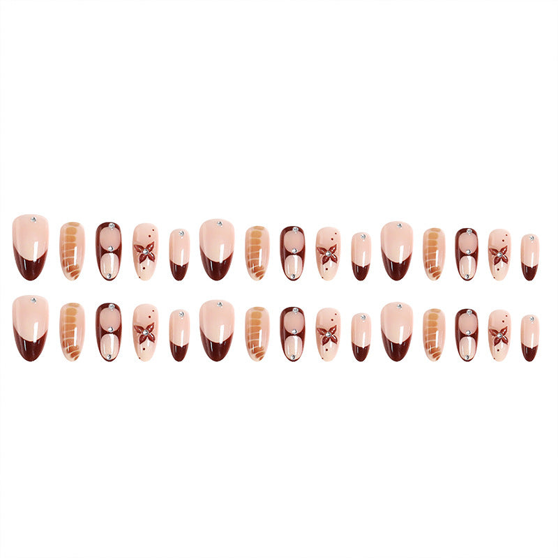 Artificial nails with elegant motif designs Bowlift