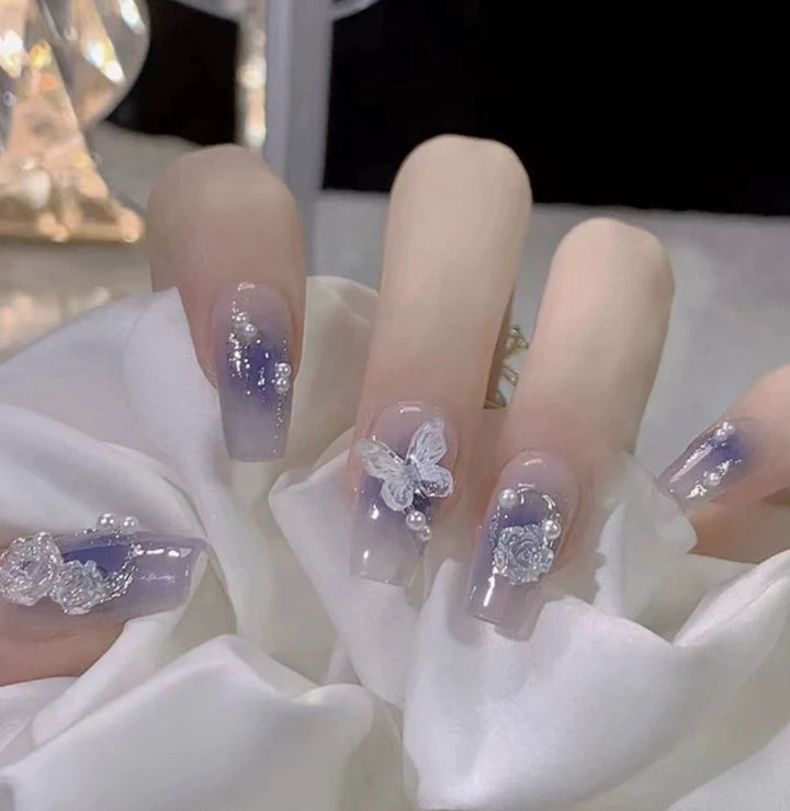 Elegant nail design with pearl embellishment Bowlift