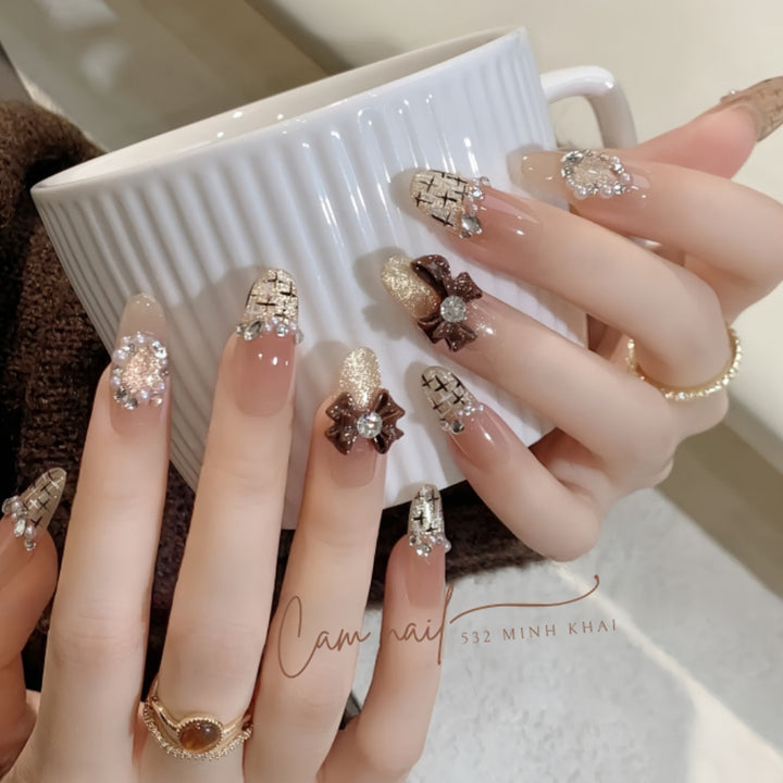 Decorative Press-On Nail Extensions with Bow and Rhinestone Accents Bowlift