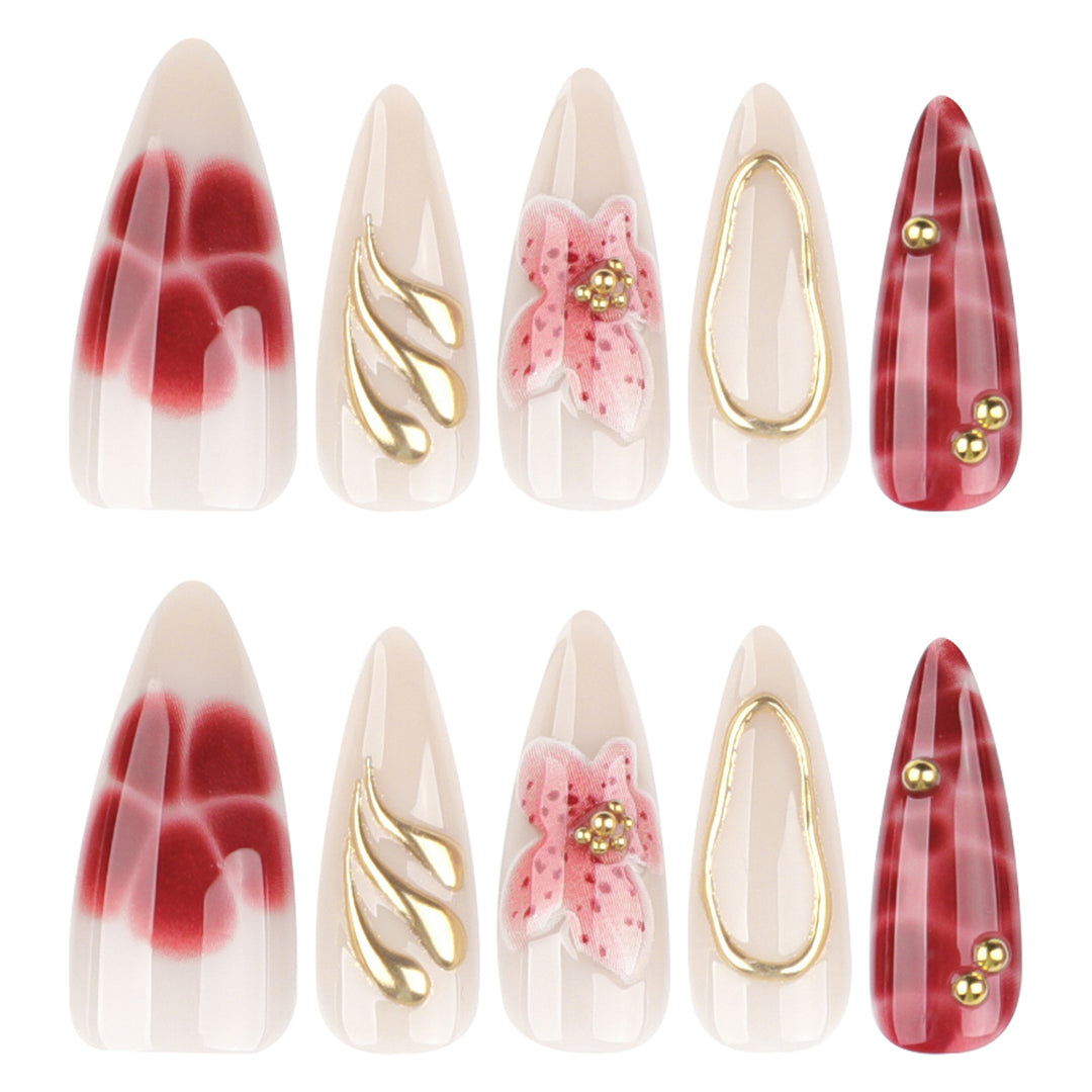 Artful stiletto nails with elegant floral designs and glitter accents Bowlift