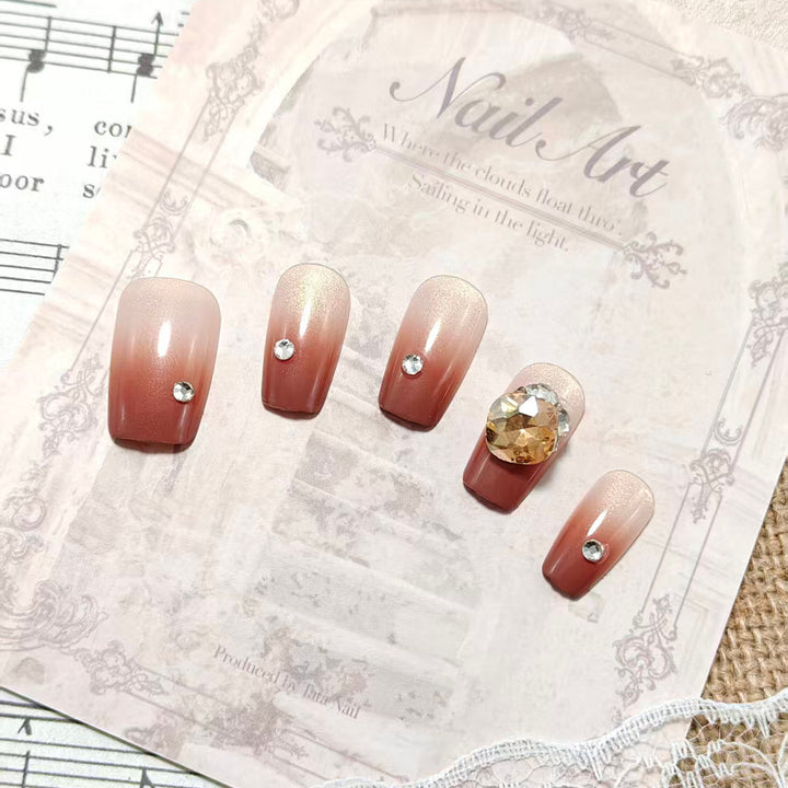 Artificial nail set with glittering rhinestone applications Bowlift