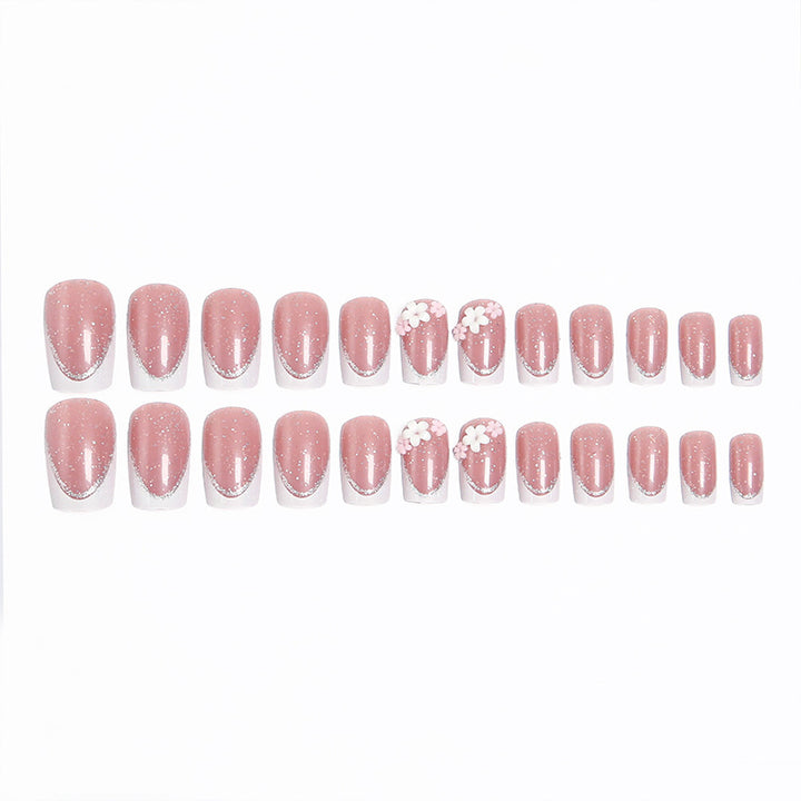 Acrylic nail set with elegant French tip and delicate floral decorations Bowlift