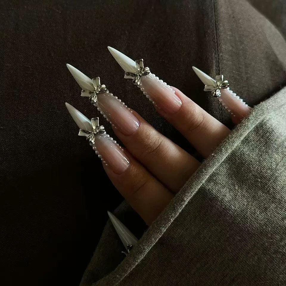 Elegant artificial nail set with 3D rhinestone details and pointed accents Bowlift