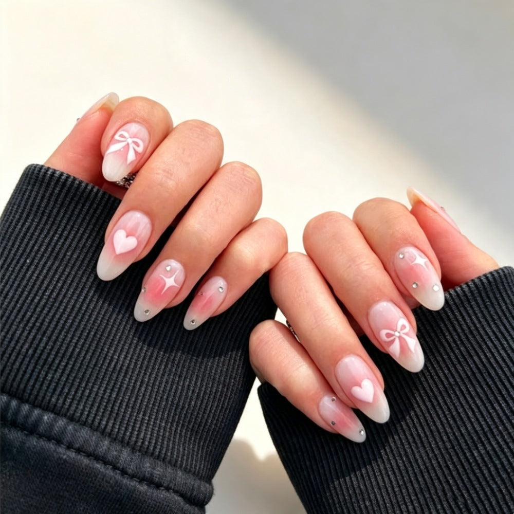 Artificial nails with romantic heart and bow design Bowlift