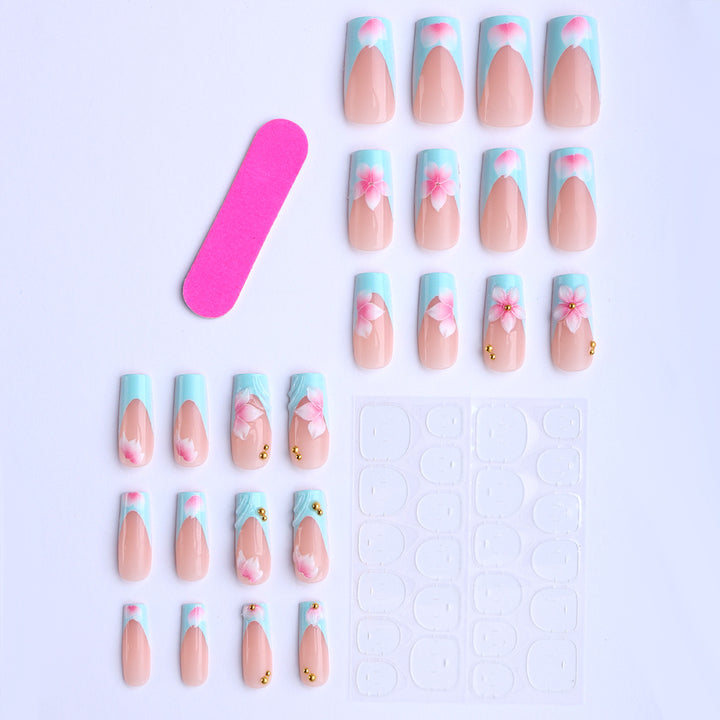 Artificial fingernails with floral design and glitter accents Bowlift