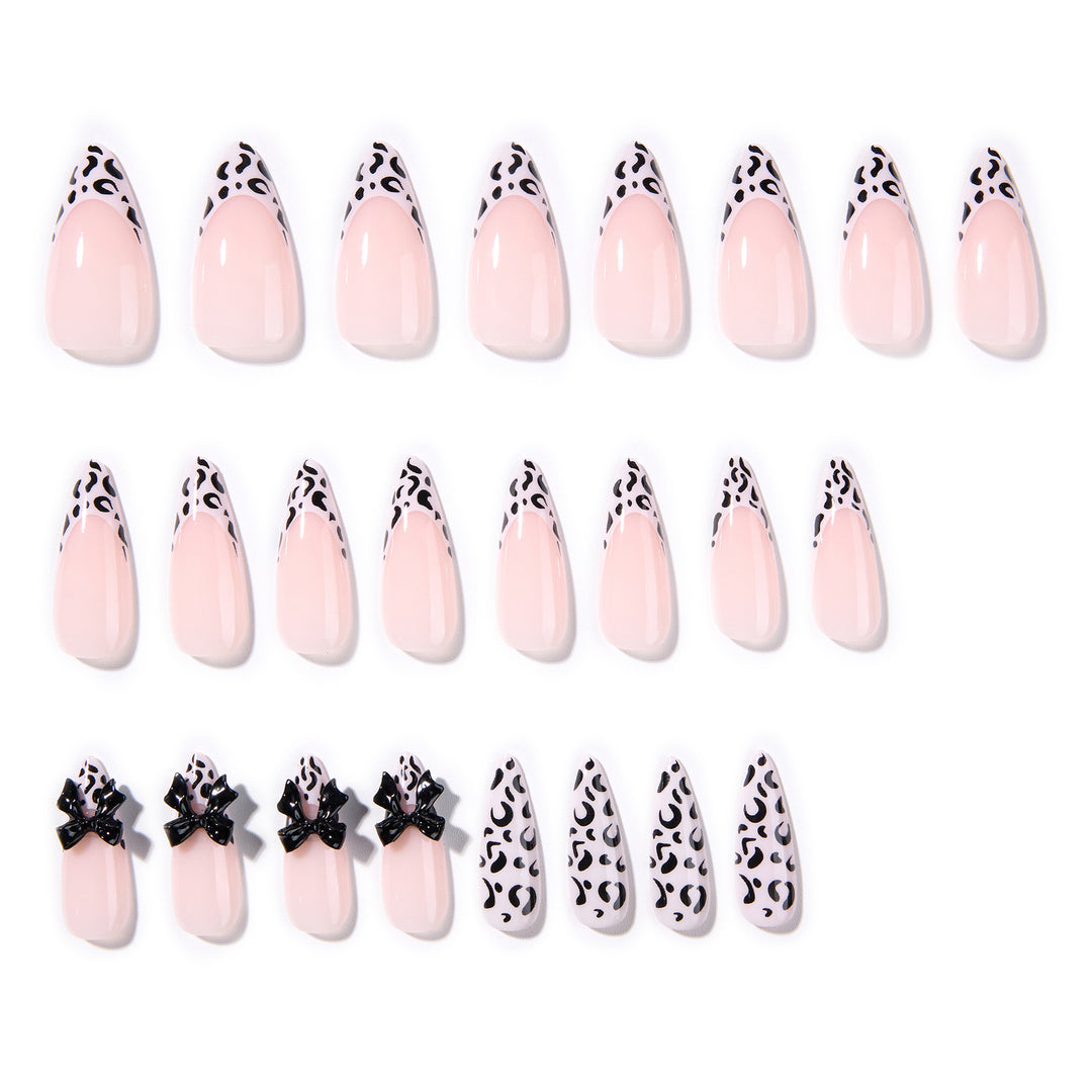 Artful Stiletto Nails with Leopard Print and Bow Accent Bowlift