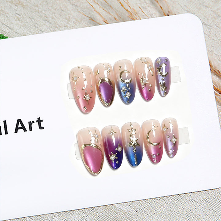 Glamorous artificial nails with star and moon motifs Bowlift