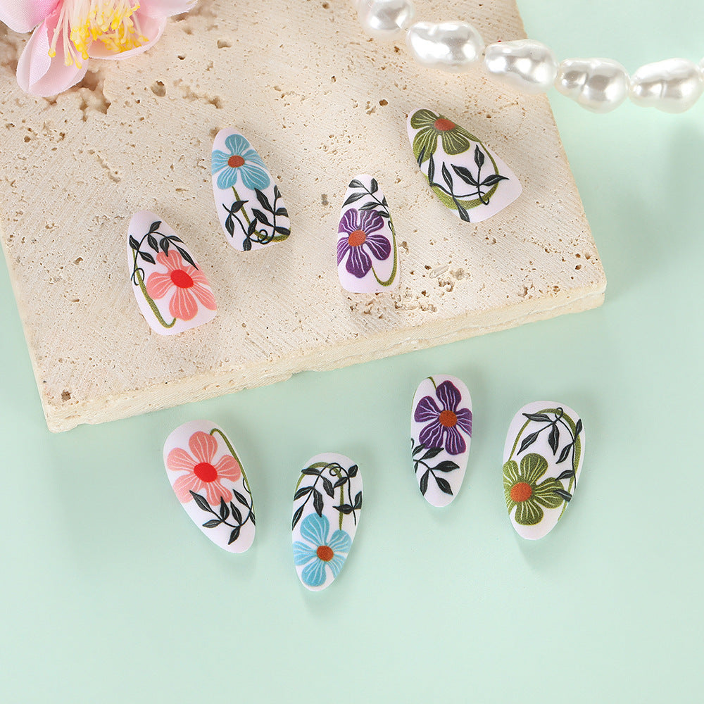 Artificial nails with floral accent Bowlift