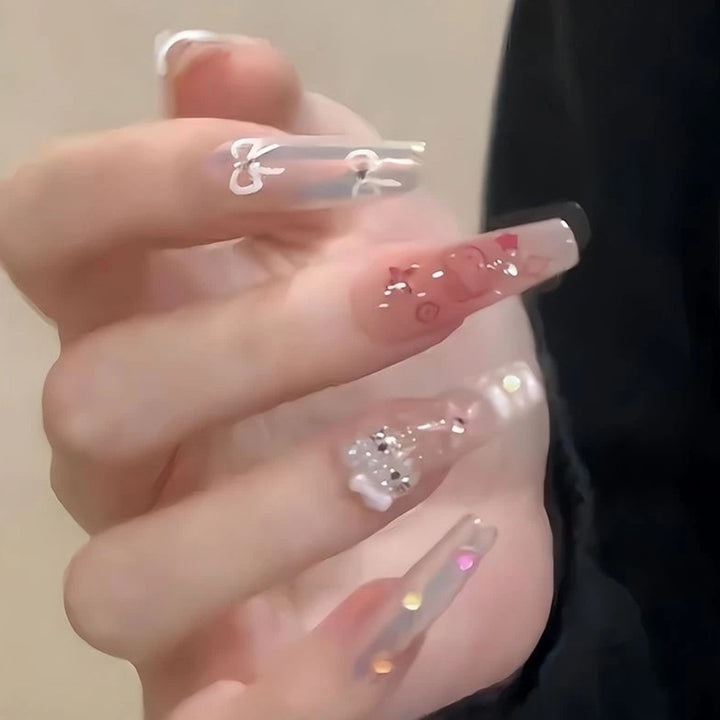 Artistic Press-On Nail Extensions with Floral Embellishments Bowlift