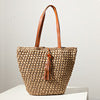 Handcrafted basket bag with fashionable tassel detail Bowlift