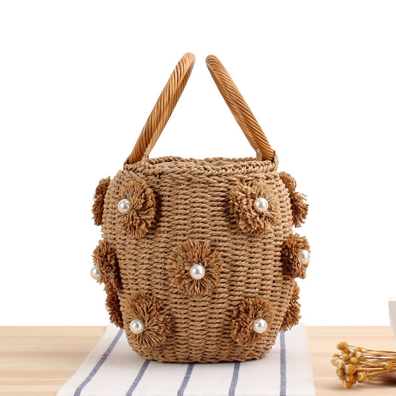 Handcrafted basket bag with bead appliqués Bowlift