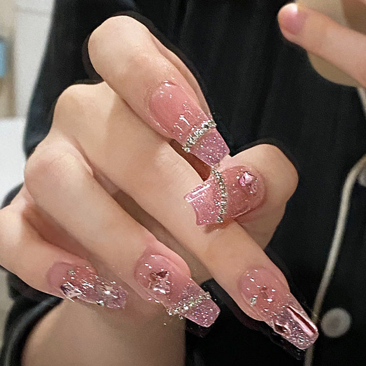 Artificial nails in creative moon and star design Bowlift