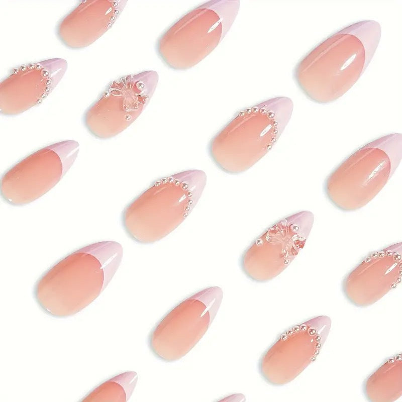 Art nail tips with delicate pearl and butterfly accents Bowlift