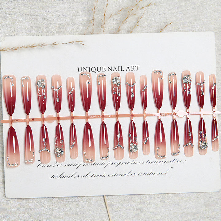 Artificial nails with elegant glitter and jewelry accents Bowlift