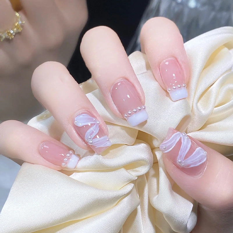 Elegant artificial nail set with stylish wave pattern and pearl accents Bowlift