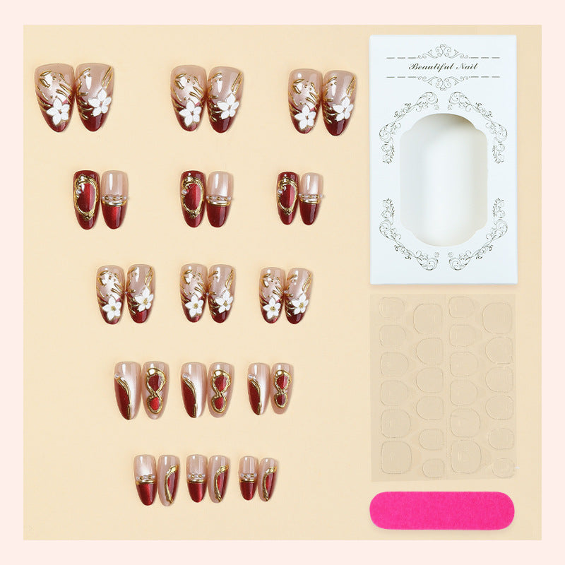 Artistic Press-On Nail Set with Floral and Metallic Accents Bowlift