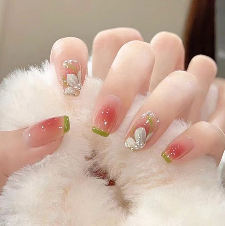 Artistic Nail Art with Glitter and Flower Applications Bowlift