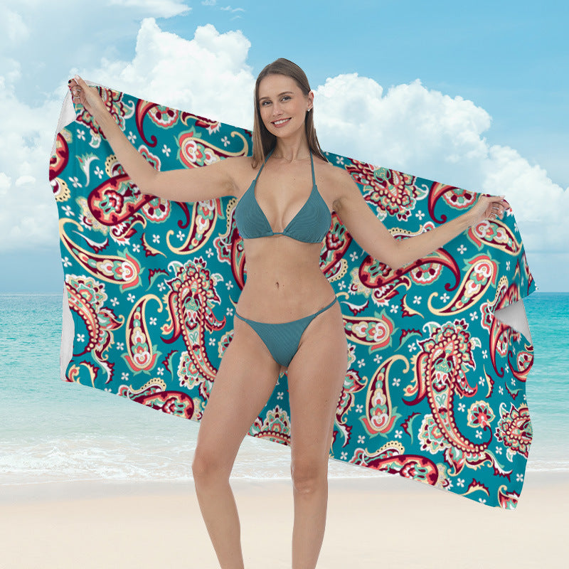 Beach towel with vibrant tropical plant motif Bowlift
