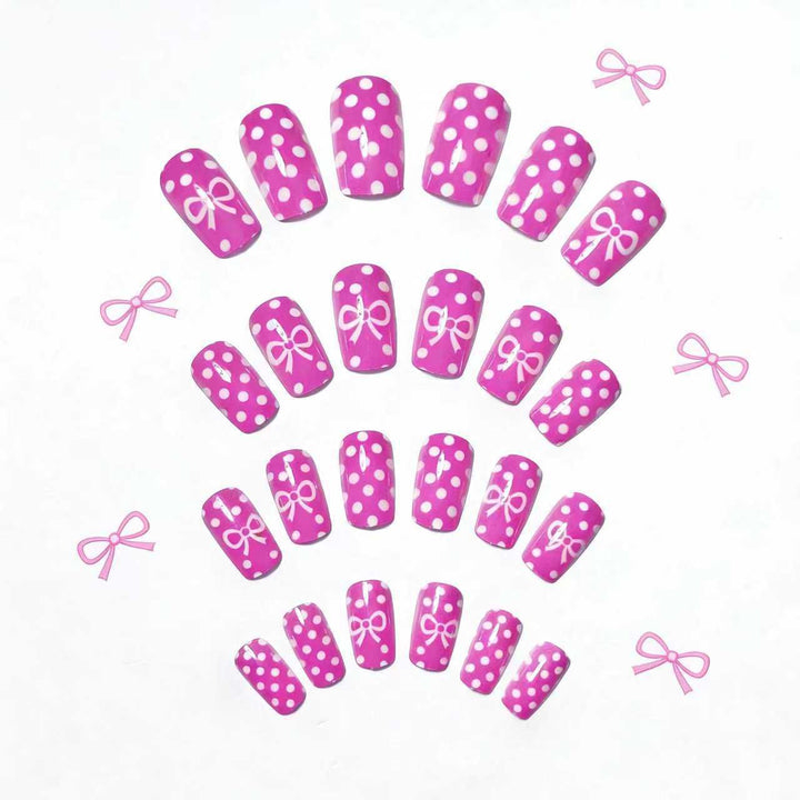 Artificial nails with romantic polka dot pattern and bow Bowlift