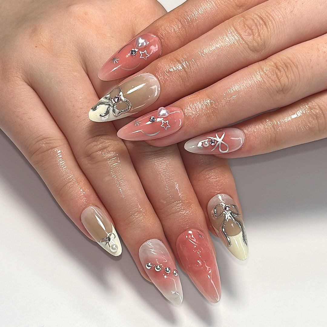 Artistic Nail Tips with Glitter and Bow Motifs Bowlift