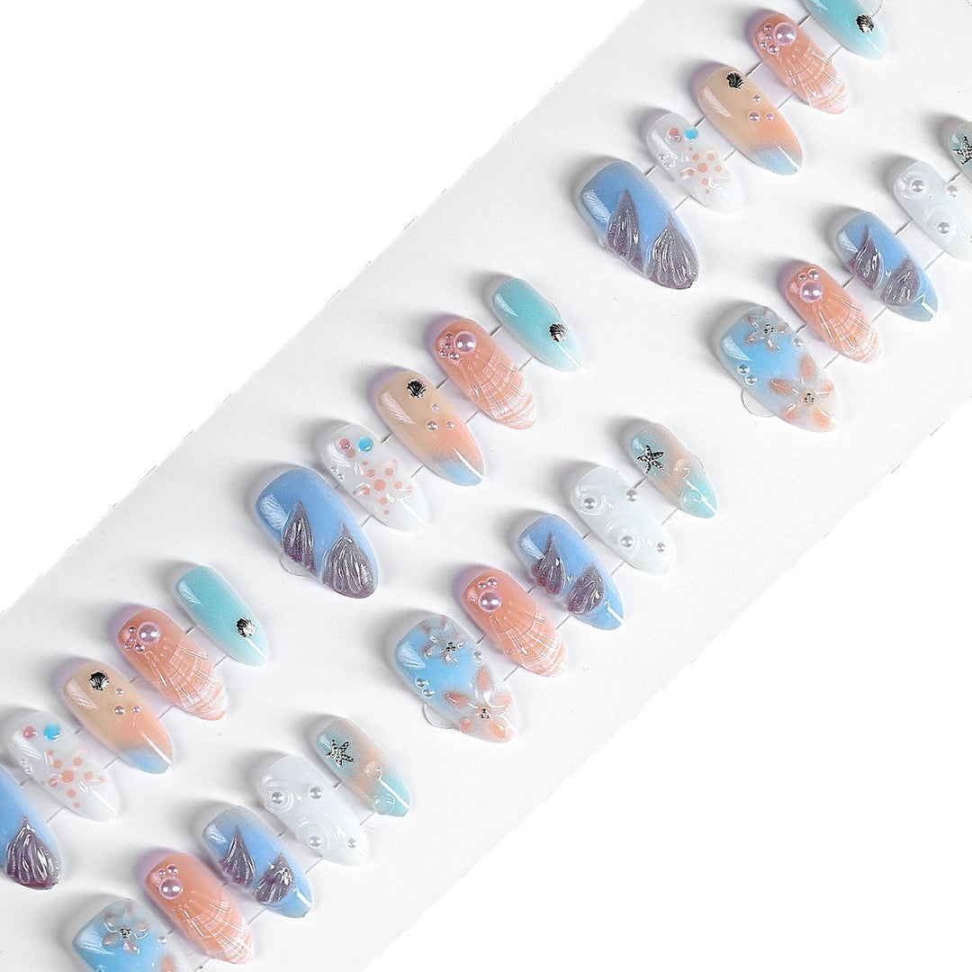 Creative nail art set with delicate floral and maritime designs Bowlift
