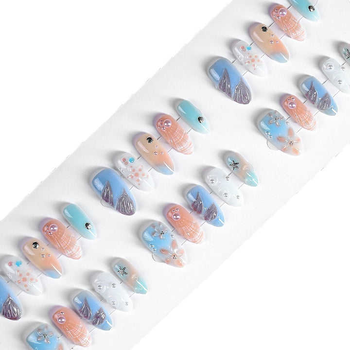 Creative nail art set with delicate floral and maritime designs Bowlift