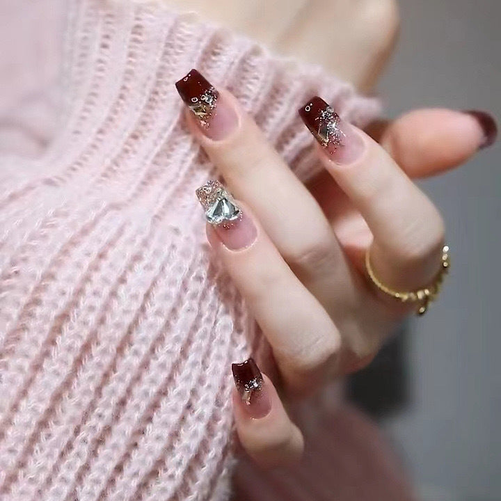 Artificials nails with glitter embellishments and elegant accents Bowlift
