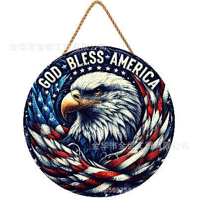 Independence Day rustic round wooden patriotic cross wall plaque with floral accents and God Bless America banner Bowlift
