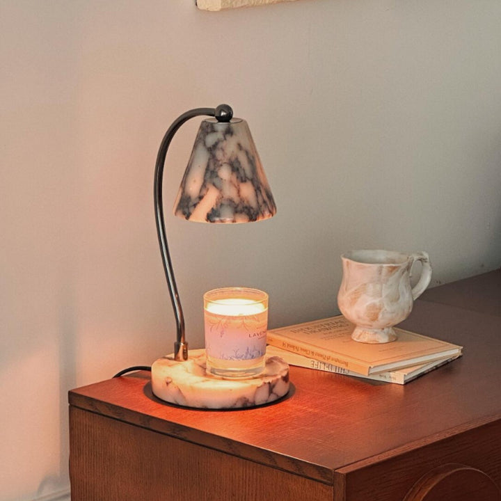Marble bedside lamp with integrated candle tray and curved metal arm Bowlift