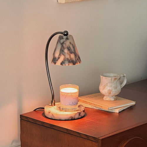 Marble bedside lamp with integrated candle tray and curved metal arm Bowlift