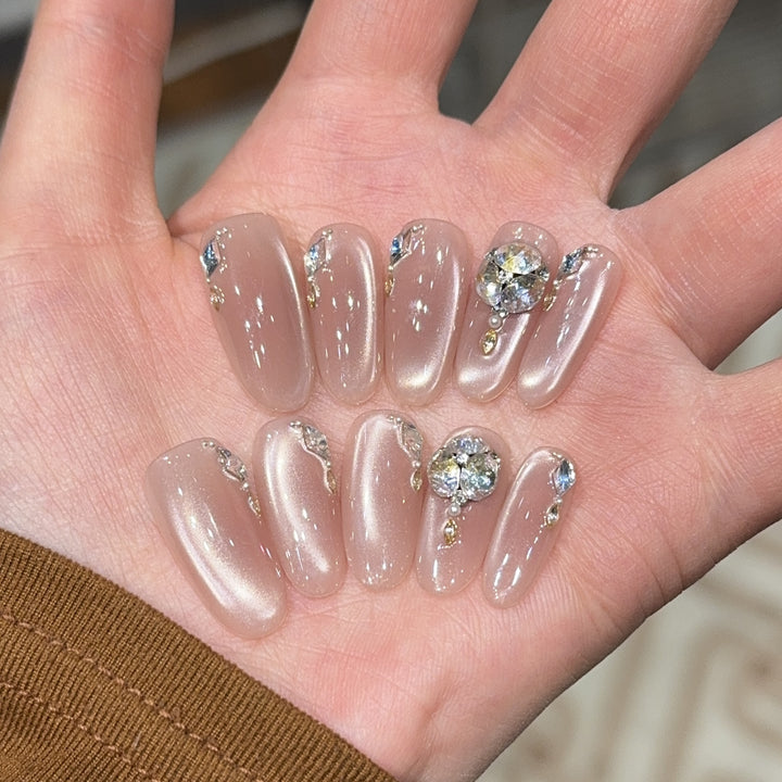 Glamorous artificial nails with rhinestone embellishments Bowlift