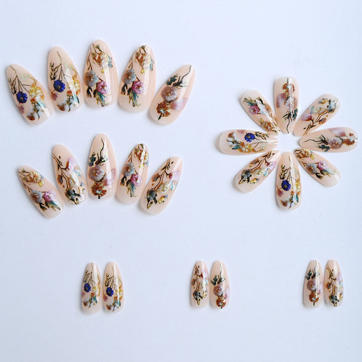 Artificial nails with floral designs and gold accents Bowlift