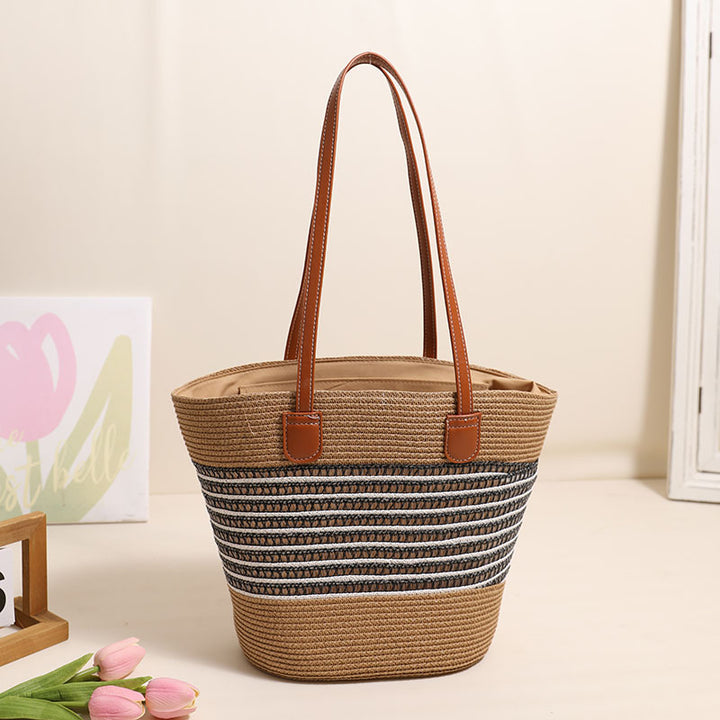 Elegant Bast bag with leather accents Bowlift