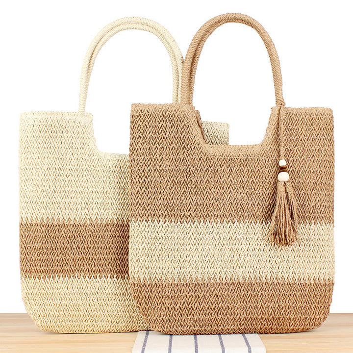 Fashionable beach tote bag made of woven natural material with fringed detail Bowlift
