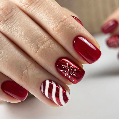 Artificial nail set with festive designs and glitter accents Bowlift