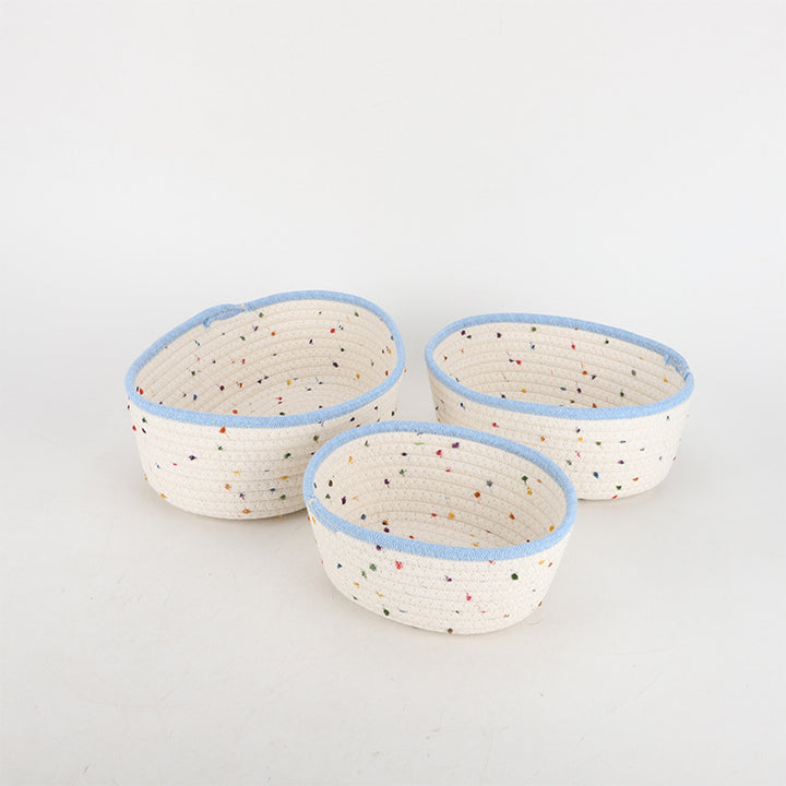 Storage basket made of natural cotton fabric with colorful dots