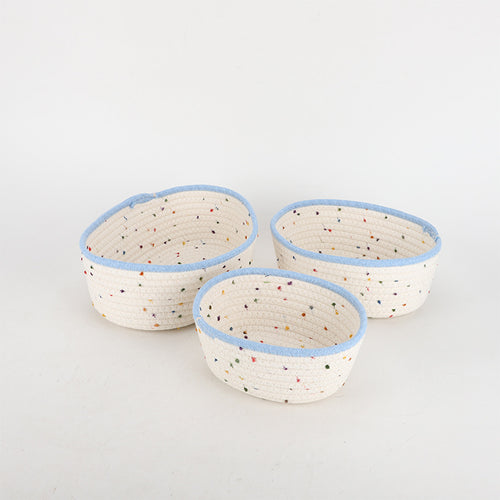 Storage basket made of natural cotton fabric with colorful dots