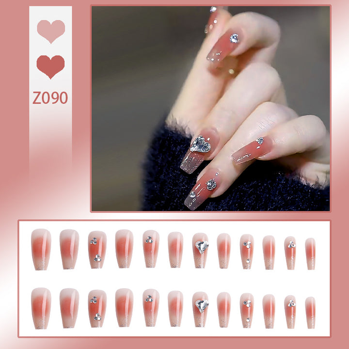 Acrylic nail set with elegant heart and rhinestone decorations Bowlift