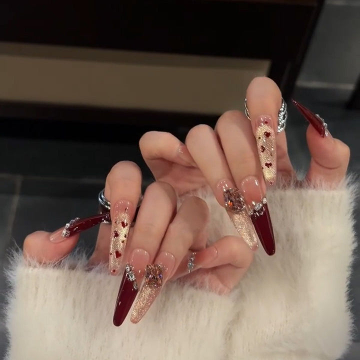 Artistic Stiletto Press-On Nail Art with Glimmering Accents Bowlift