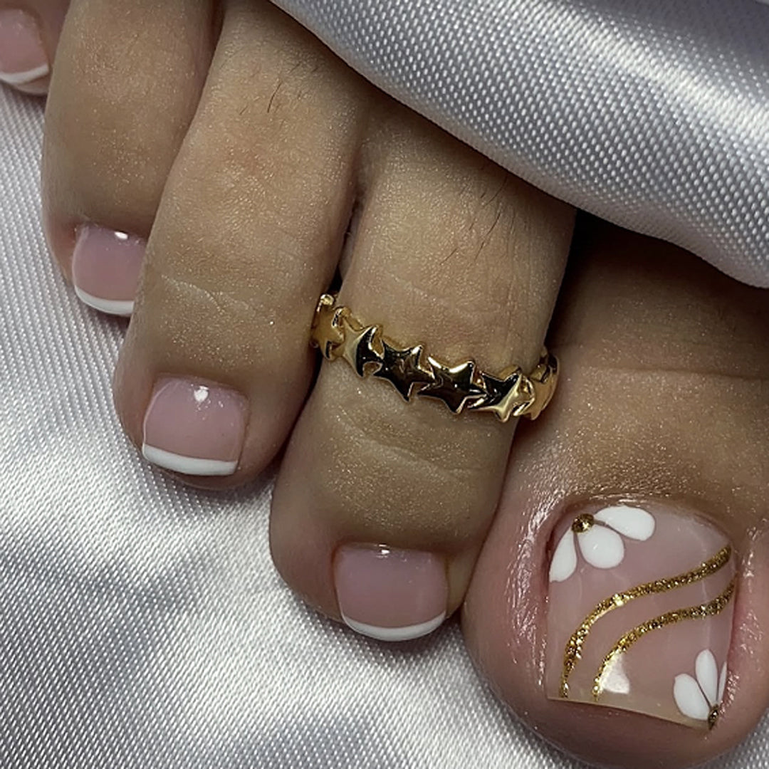 Nail art with elegant blooming designs and glitter accents Bowlift