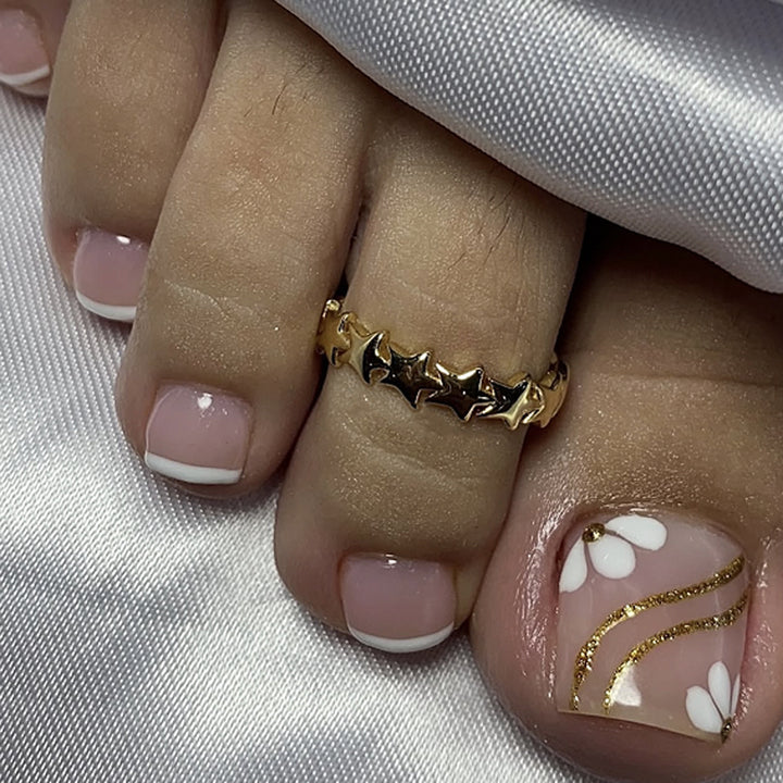 Nail art with elegant blooming designs and glitter accents Bowlift
