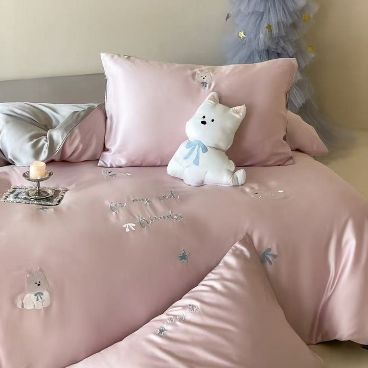 Luxurious satin bedding set with embroidered cherry motifs, reversible function and plush bunny pillow