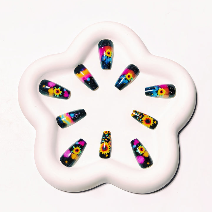 Artificial nails in creative sunflower and galaxy design Bowlift